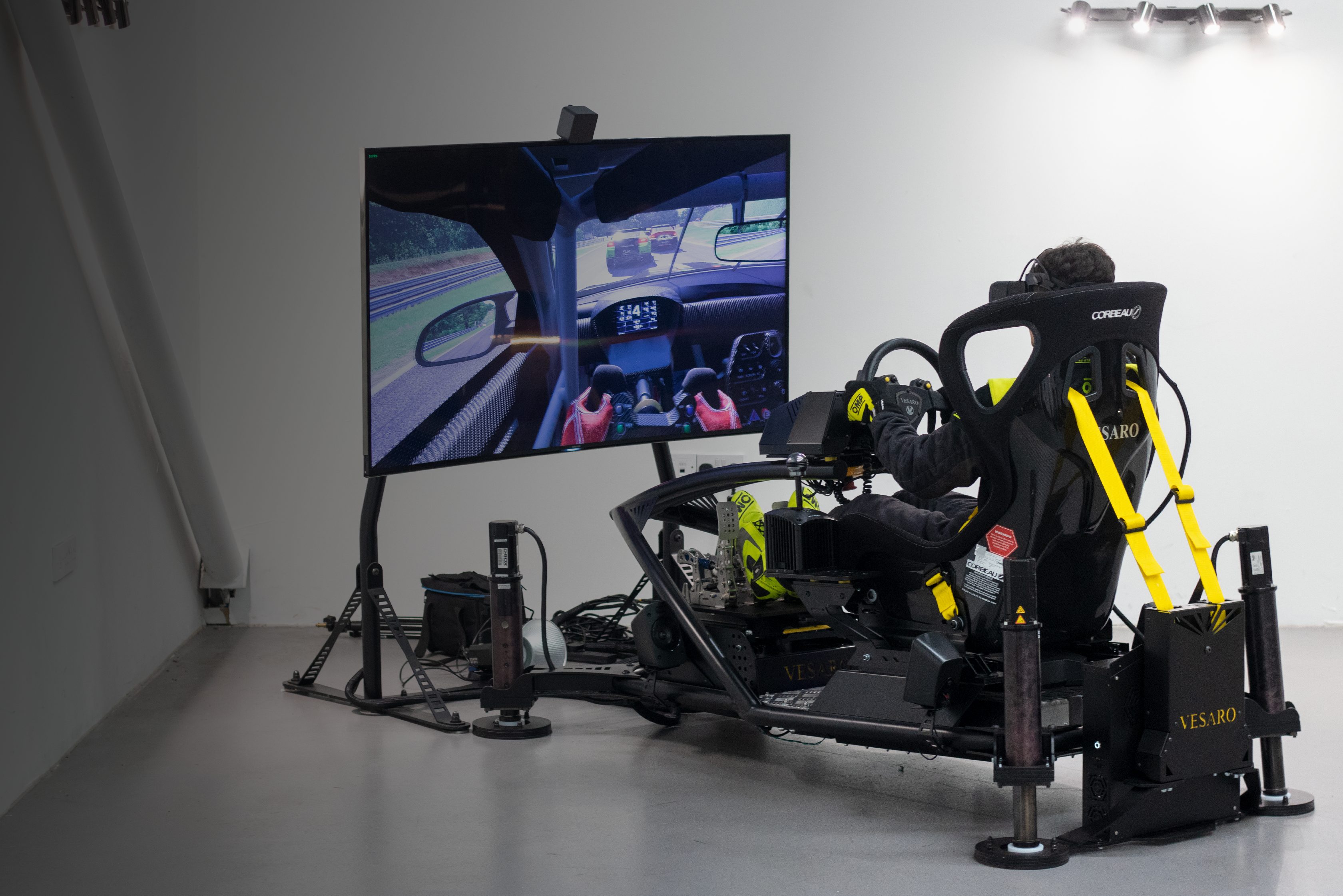 Sim racing rig with integrated VR headset